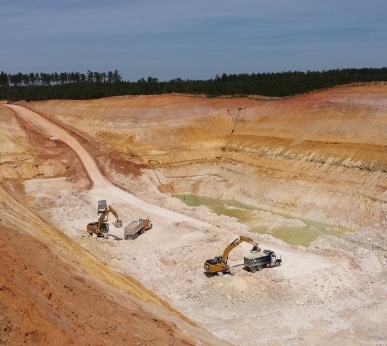 excavators loading trucks